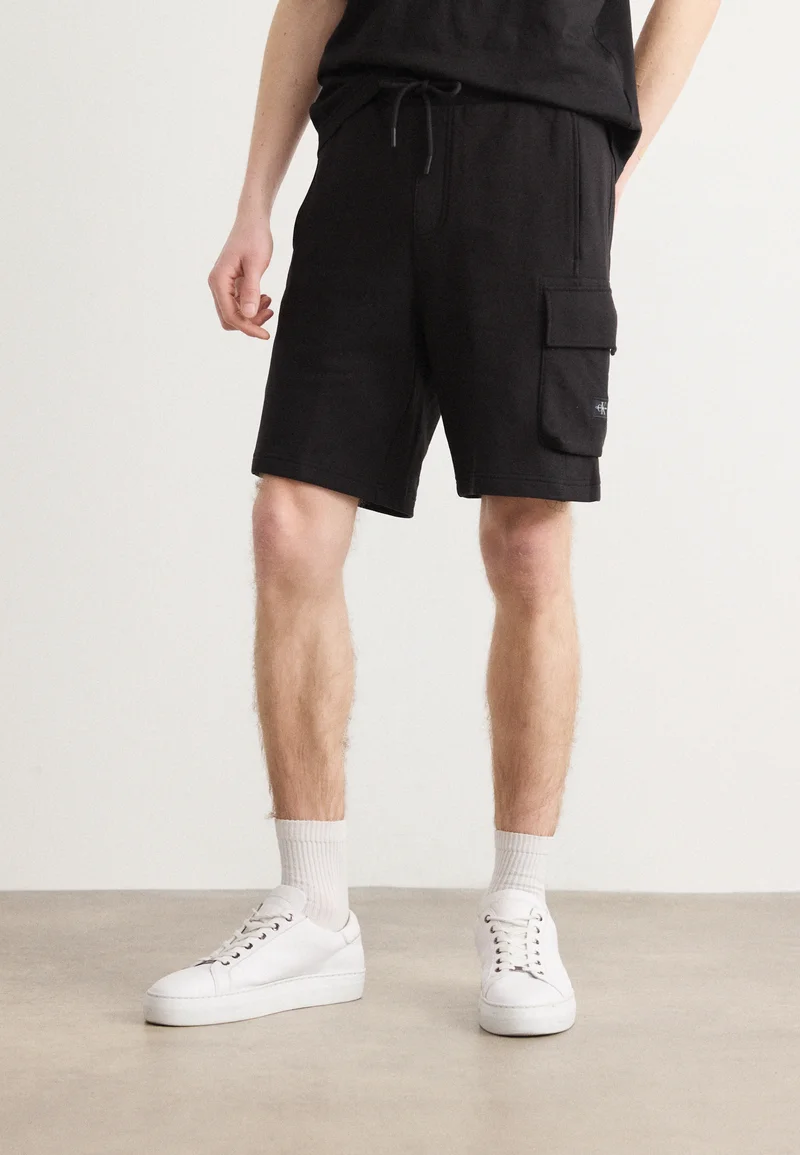 Top Designer Collections Calvin Klein Jeans LABEL - Tracksuit bottoms black Clothing Shorts Casual Shorts