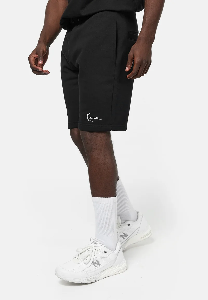 enjoy great discount Karl Kani SIGNATURE  - Tracksuit bottoms black Clothing Shorts Casual Shorts