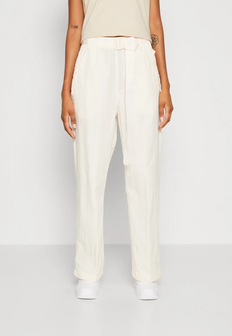 Sale USA Online Nike Sportswear AIR - Trousers guava ice/white Streetwear Sale Streetwear Clothing Socks Casual Trousers